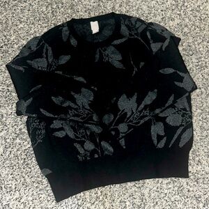 NWOT. Woman’s Black H&M stretchy sweater. With sparkly floral pattern. Size Xxl.